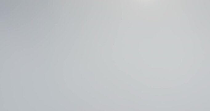 Aerial drone fly through white fluffy clouds part reveal bright blue sky. Perfect for travel or nature themes. Natural background, nature landscape