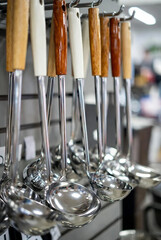 Stainless Steel Kitchen Ladles with Wooden Handles on Retail Display