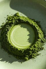 Vibrant Green Matcha Green Tea Powder with Artistic Circular Indentation