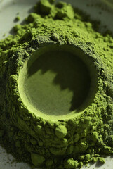 Vibrant Green Matcha Green Tea Powder with Artistic Circular Indentation