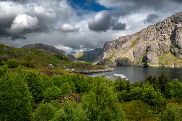 Naklejka premium Old Fishermen Village Nusfjord With Rorbuer Huts And Calm Fjord On Lofoten Islands In Norway