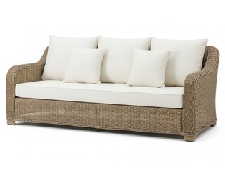 Comfortable wicker sofa with white cushions and pillows