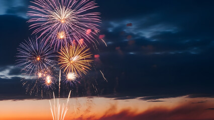 Vibrant fireworks display over a serene beach at dusk