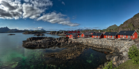 Picturesque Red Rorbuer Huts At The Coast On Lofoten Islands In Norway