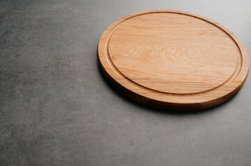 Meat or bread cutting board for homemade baking on table. Food recipe concept at stone background texture with copy space. Flat lay top view