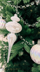 Festive Scandinavian Christmas Tree with White Silver Ornaments.