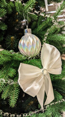 Festive Scandinavian Christmas Tree with White Silver Ornaments.