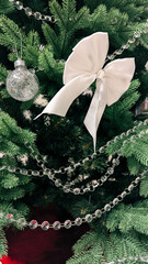 Festive Scandinavian Christmas Tree with White Silver Ornaments.