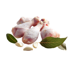 Fresh raw chicken drumsticks with garlic and bay leaves ready for a delicious meal, perfect for cooking blogs or culinary projects and healthy recipes