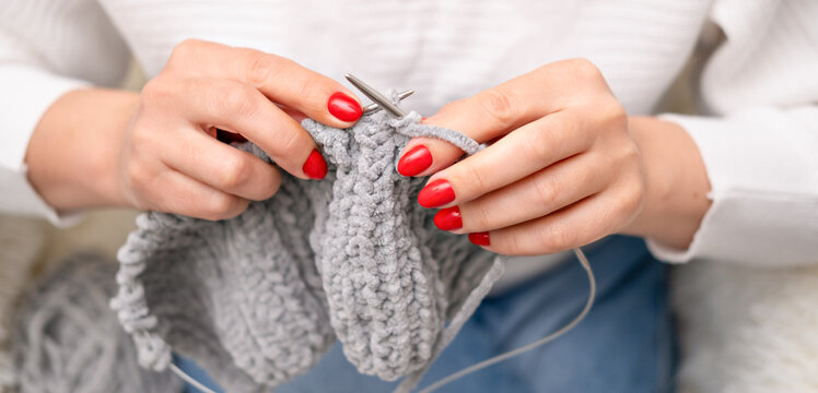 female hands knitting close up