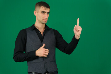 Young handsome man over isolated background pointing finger up with successful idea. Exited and happy. Number one. High quality photo