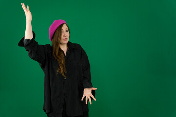 Woman uses hand gesture to beckon come here, while another woman stands with palm extended in a welcoming pose, cheerful expressions isolated in white studio background. High quality photo