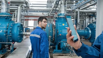 Medium shot of a mobile app with interactive controls and detailed status updates for remote monitoring of industrial systems