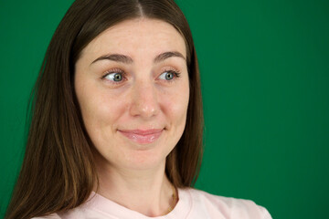 portrait of a young hispanic latina woman with a phone and a surprised expression. High quality photo