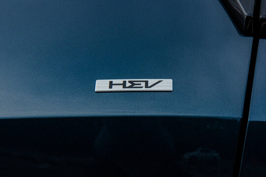 October 19, 2021, Seoul, South Korea - Close-up of the HEV (Hybrid Electric Vehicle) emblem on a Kia Sportage.