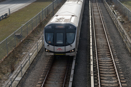 Toronto Transit Commission subway car heading north from Cedarvale Station (Eglinton West subway stn) on Line 1, viewed from Elm Bridge Dr