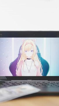 Money falling over VTuber anime girl on monitor screen