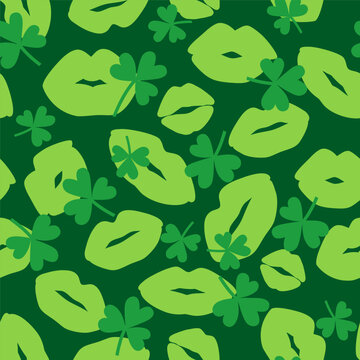 Green lip print with shamrock silhouette on green background. Seamless pattern with kiss. Decorative wallpaper for St Patrick's day holiday design. Vector stock illustration