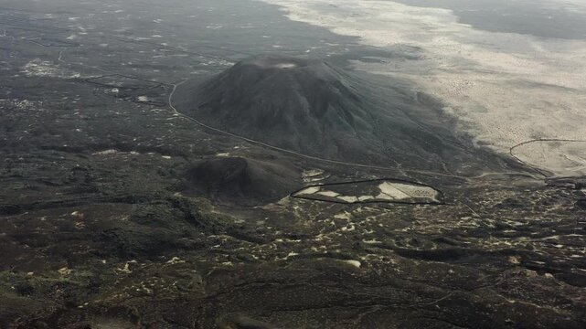 Aerial view over La Mancha crater in the volcanic Area of the Bayuyo, on the Island of Fuerteventura, Spain