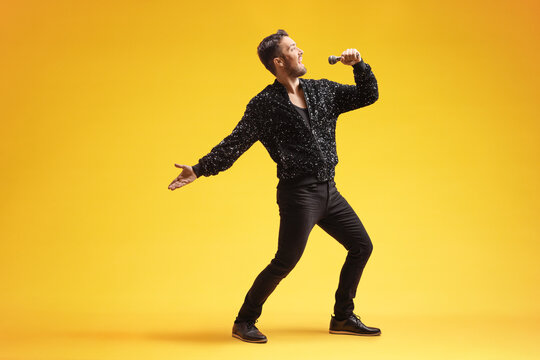 Showman singing into a microphone