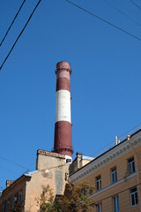 Fototapeta premium striped chimney against blue sky