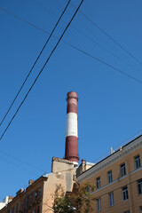 striped chimney against blue sky