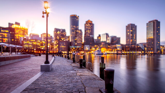 Conceptual image of Boston in Massachusetts, USA at night showcasing its architecture and night life.