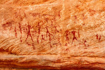 Naklejka premium Neolithic rock art. famous rock paintings depicting people. Bovidian period. Tadrart Rouge. Tassili N'Ajjer National Park, Djanet, Algeria, Africa