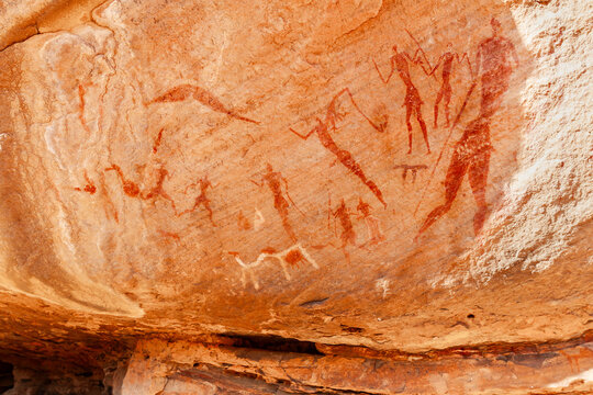 Neolithic rock art.  famous rock paintings depicting people. Bovidian period. Tadrart Rouge. Tassili N'Ajjer National Park,   Djanet, Algeria, Africa