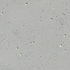 Close up of a weathered light grey concrete surface with small imperfections
