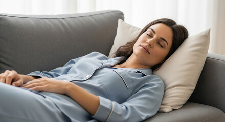 A woman in blue pajamas sleeping peacefully on a sofa, perfect for mattress ads, sleep health, and relaxation goals
