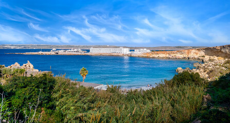 Malta &ndash; panoramic view from above of Paradise Bay with fine sand beach, clear turquoise water, rocky outcrops in the sheltered bay
