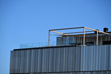 Obraz premium Modern office building with an interesting perforated metal facade