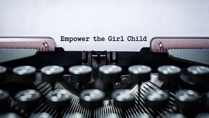 Vintage typewriter with message advocating for girl child empowerment  