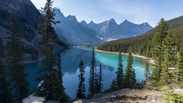 Banff National Park Moraine Lake sunrise time lapse with shadows revealing vivid turquoise water. Alberta, Canada.