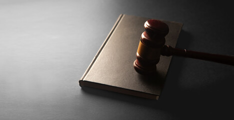 judge gavel on black background with space for text. law concept