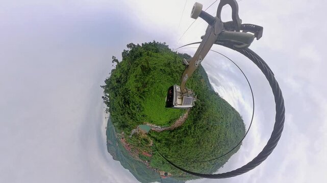 Cable Car in Tiny Planet Effect Forming Circular Forest World with Curved Horizon and Suspended Cabin during Creative Travel Concept