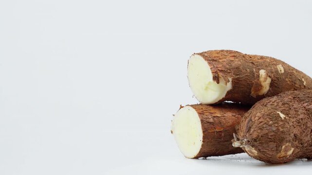 Freshly Harvested Cassava Root Rotating on White Background