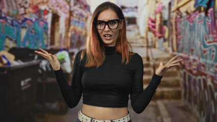 Woman redhead wearing glasses revealing midriff, arms crossed then shrugging with expressive hands...