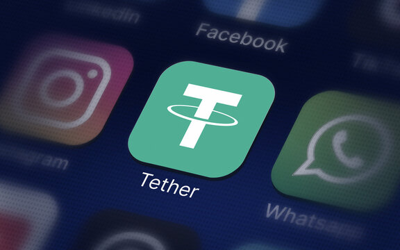 Tether crypto logo on the smartphone