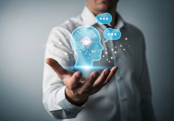 A man holding a glowing ai head with speech bubbles in his hand, suggesting communication and technology