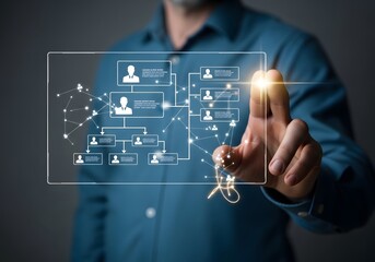 Man interacting with digital organizational chart on transparent screen interface display technology