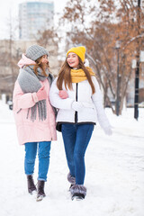 Winter portrait of two young girlfriends