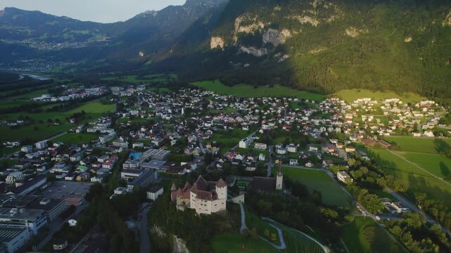 Aerial view around the village Balzers in Liechtenstein beside Switzerland on a cloudy afternoon in summer.