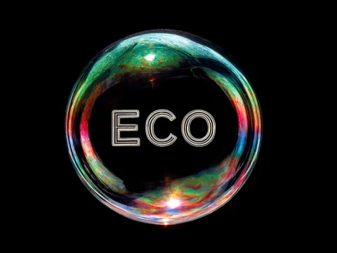 Organic ECO Text Resting on Branch With Plants
