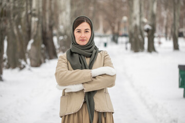 Fototapeta premium Winter portrait of a middle-aged brunette model