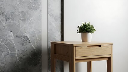 Light wood nightstand with a small potted plant on