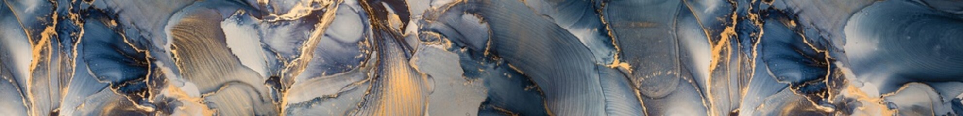 Abstract luxury blue and gold fluid art texture mimicking marble and alcohol ink