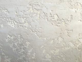 Rough stucco wall surface presenting an abstract texture