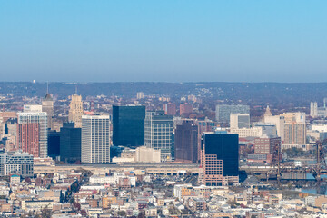 Aerial view of Newark, New Jersey shows a dense urban landscape with a mix of modern skyscrapers and older buildings. 
